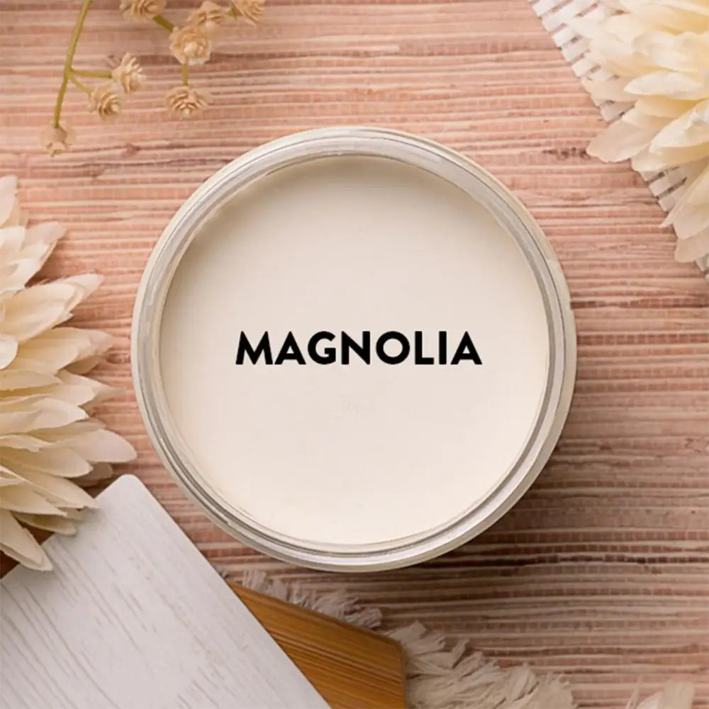 An arial view of an open container of Dixie Belle Paint Company's Magnolia Chalk Mineral Paint is shown with black text reading Magnolia.