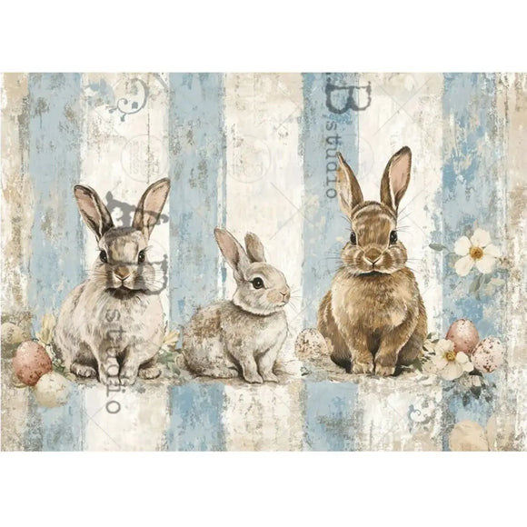Decorative paper with rabbit illustrations and floral elements on a textured background, featuring the brand 'B Studio'.