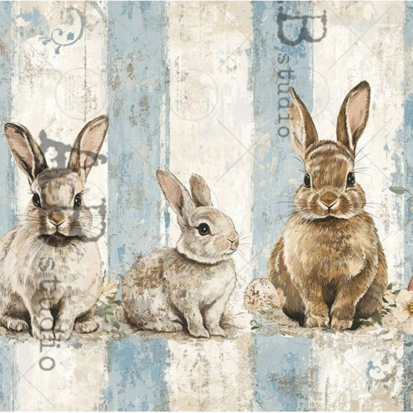 Closeup of Milky Valley Bunny Trio Blue Stripes A4 rice decoupage paper showing watercolor bunnies on rustic blue stripe background with speckled eggs