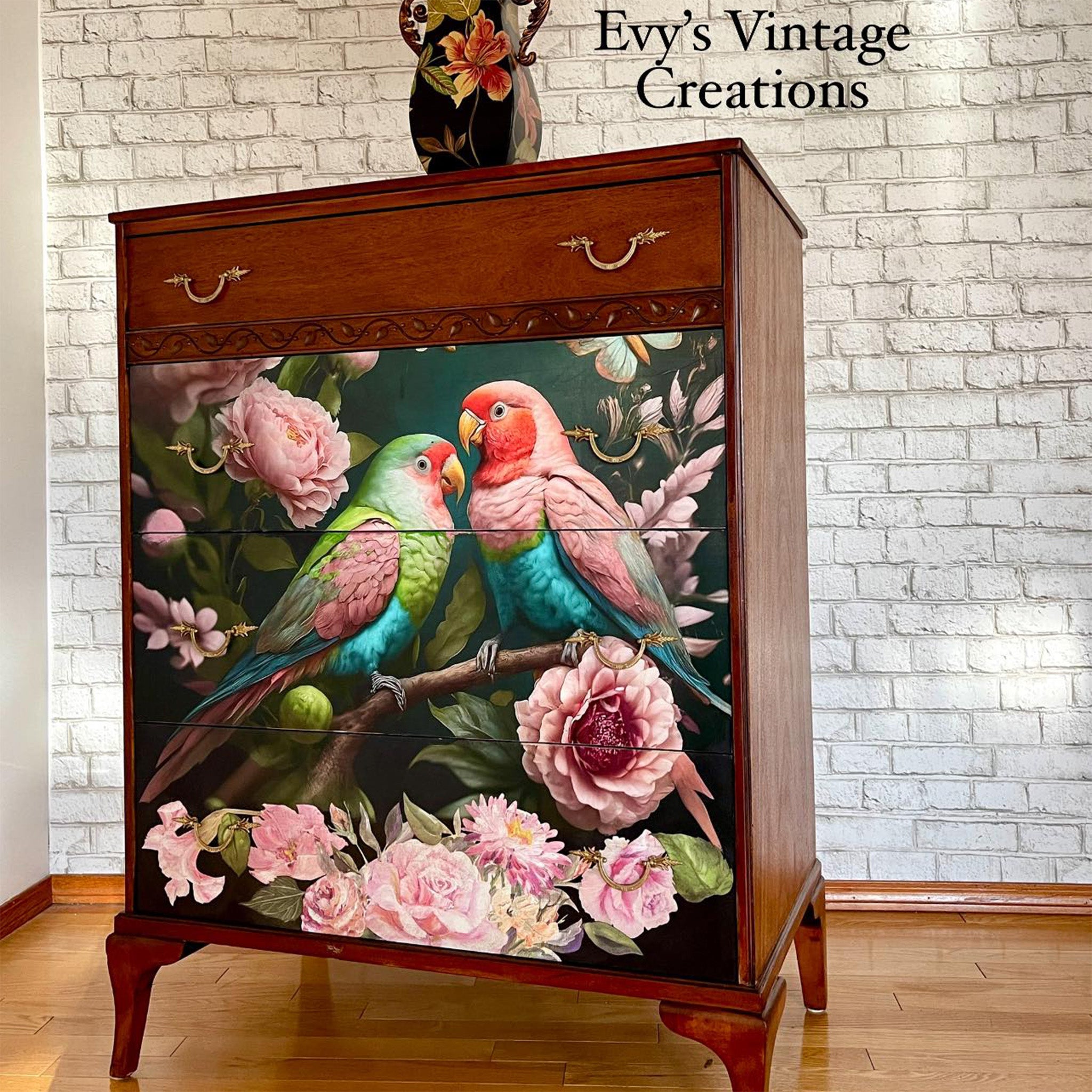 A vintage 4-drawer chest dresser refurbished by Evy's Vintage Creations is has a dark red wood stain and features Mint by Michelle's Pastel Love decoupage paper on the bottom 3 drawers.