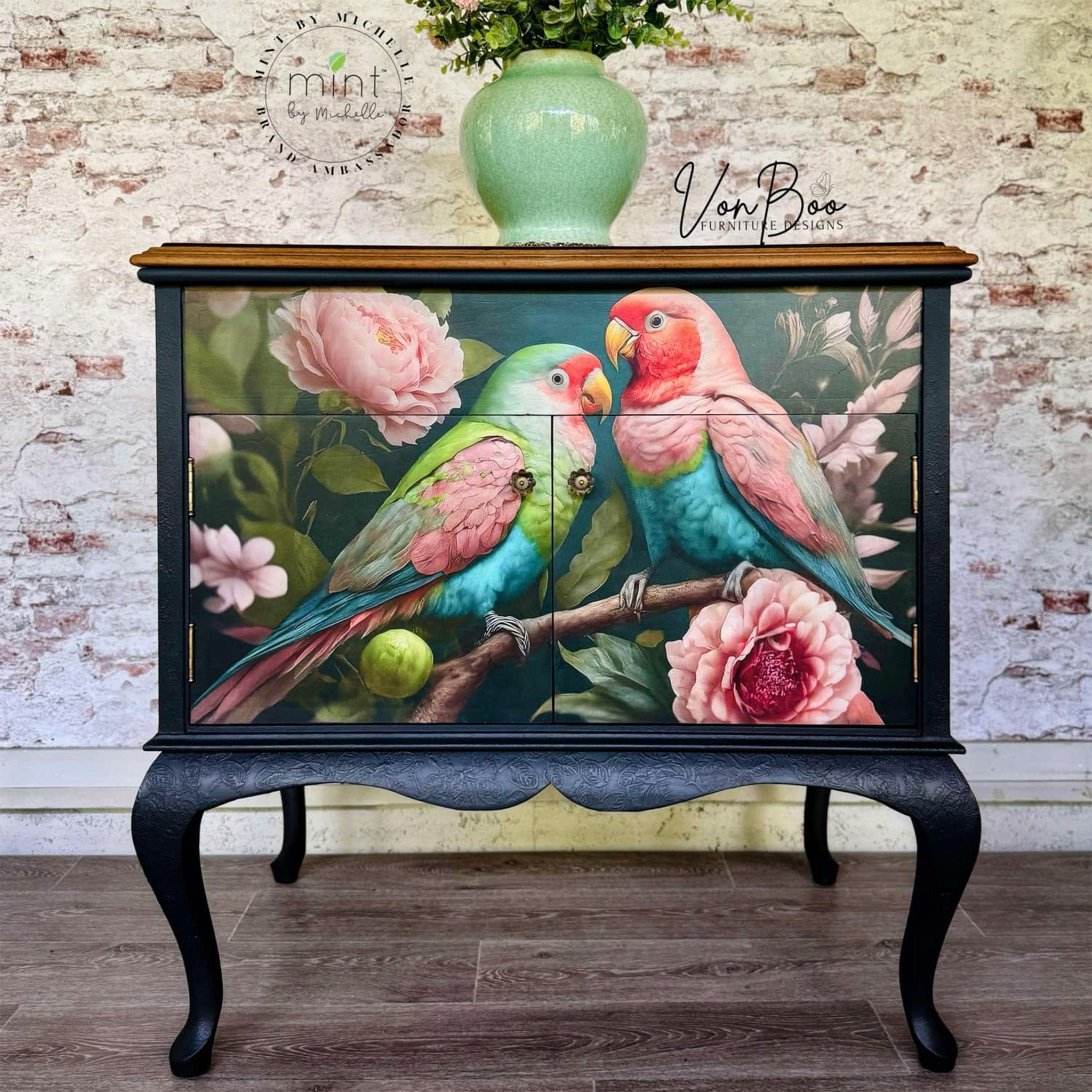 A vintage bar cabinet refurbished by Von Boo Furniture Designs is painted navy blue and features Mint by Michelle's Pastel Love decoupage paper on the front.