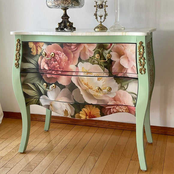 A vintage 2-drawer dresser is painted mint green with gold accents and features Mint by Michelle's Summer Blush decoupage paper on the drawers.