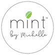 A white background has a simple black outlined circle with the words Mint by Michelle with a mint leaf above the letter I in mint.