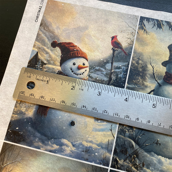Winter-themed card with a snowman and cardinal, ruler for scale