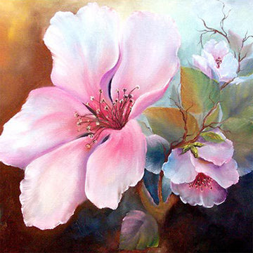 Close-up of a rice paper featuring soft pink watercolor magnolia blooms against a split color background of warm and cool tones.