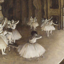 Close-up of a rice paper featuring a sepia toned design of ballerinas practicing on a stage. 