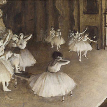 Close-up of a rice paper featuring a sepia toned design of ballerinas practicing on a stage. 