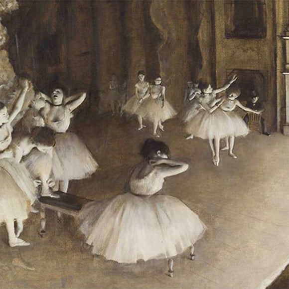 Close-up of a rice paper featuring a sepia toned design of ballerinas practicing on a stage. 
