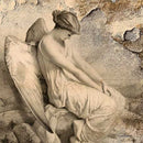 Close-up of a rice paper featuring a creamy image of a serene angel sitting on a rock with her head bowed.