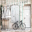 Close-up of a rice paper featuring a charming bicycle against a vintage building with elegant French scripting and soft cream and mint stripes.