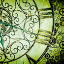 Close-up of a rice paper featuring a zoomed in image of a green clock face with intricate details and roman numerals.