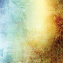 Close-up of a rice paper featuring a vibrant ombre design in shades of blue, green, yellow, and brown with a distressed texture.