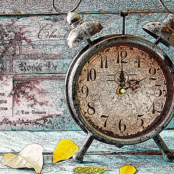 Close-up of a rice paper featuring a faded barnwood design with a vintage metal clock and dried leaves.