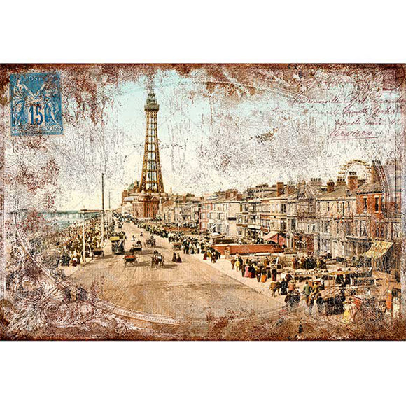 Rice paper of a vintage sepia colored postcard featuring a quaint city street with an iron tower in the distance.