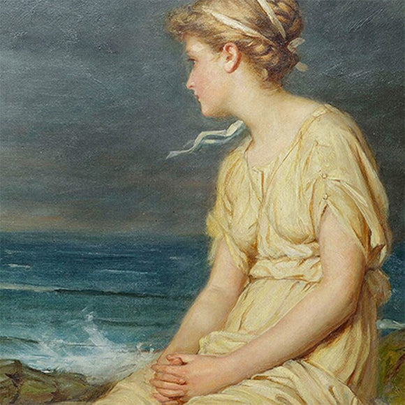 Close-up of a rice paper featuring a serene scene of a Grecian woman in a cream dress sitting on a rock by the dark seaside.