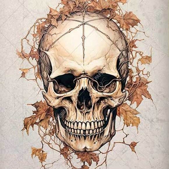 Close-up of a rice paper design that features a skull covered with decaying leaves.