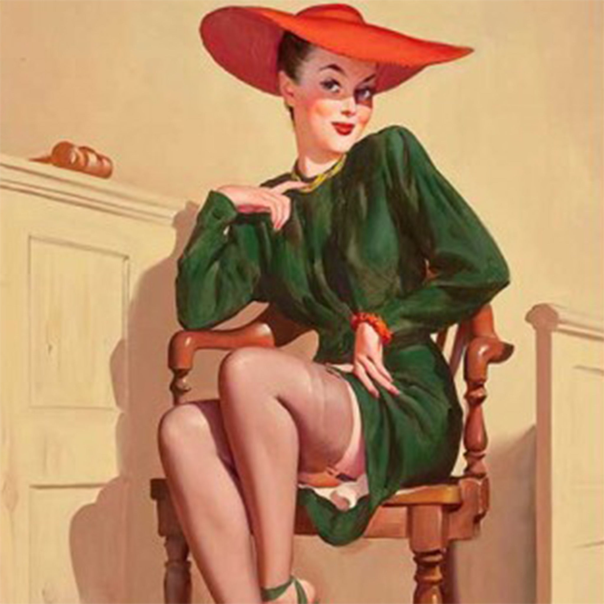 Close-up of a rice paper design featuring a fashionable lady in a stunning green gown and a burnt orange hat posing in a chair. 