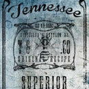 Close-up of a rice paper featuring a vibrant blue Tennessee whiskey label design.