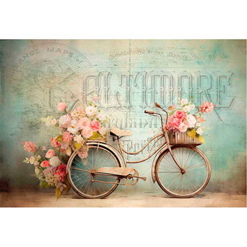 Rice paper that features a Victorian bicycle adorned with pink and white roses sits against a French scrip backdrop. White borders are on the top and bottom.
