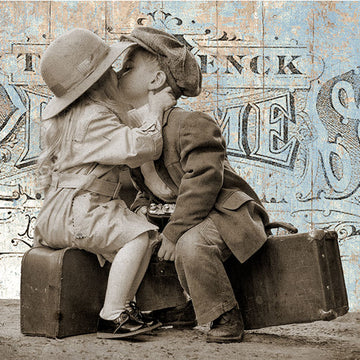 Close-up of Paper Designs Italy Vintage Suitcase Kiss A4 rice decoupage paper showing vintage children kissing on suitcases with distressed travel postcard background.