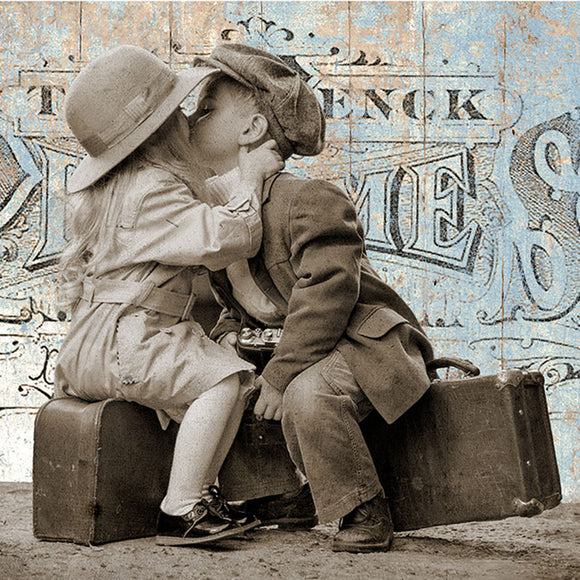 Close-up of Paper Designs Italy Vintage Suitcase Kiss A4 rice decoupage paper showing vintage children kissing on suitcases with distressed travel postcard background.