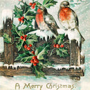 Close-up of a rice paper featuring two cheerful robins perch on a fence post surrounded by holly berries against a snowy backdrop, with the festive greeting "A Merry Christmas" below.