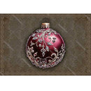 Decorative red ornament with silver intricate design on a textured brown background