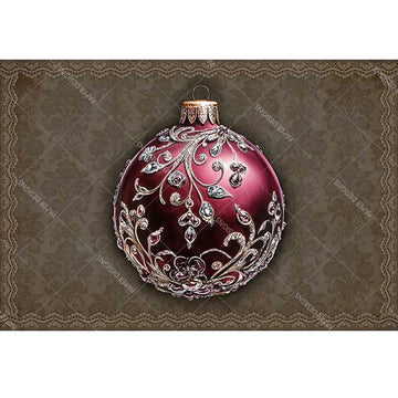 Decorative red ornament with silver intricate design on a textured brown background