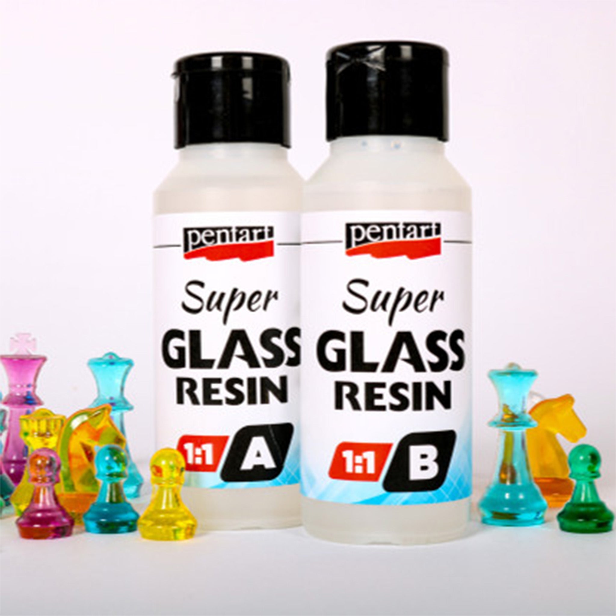 Two containers, bottle A and bottle B, of Pentart's Super Glass Resin 1:1 are shown against a white background with colorful transparent chess pieces created from the resin.