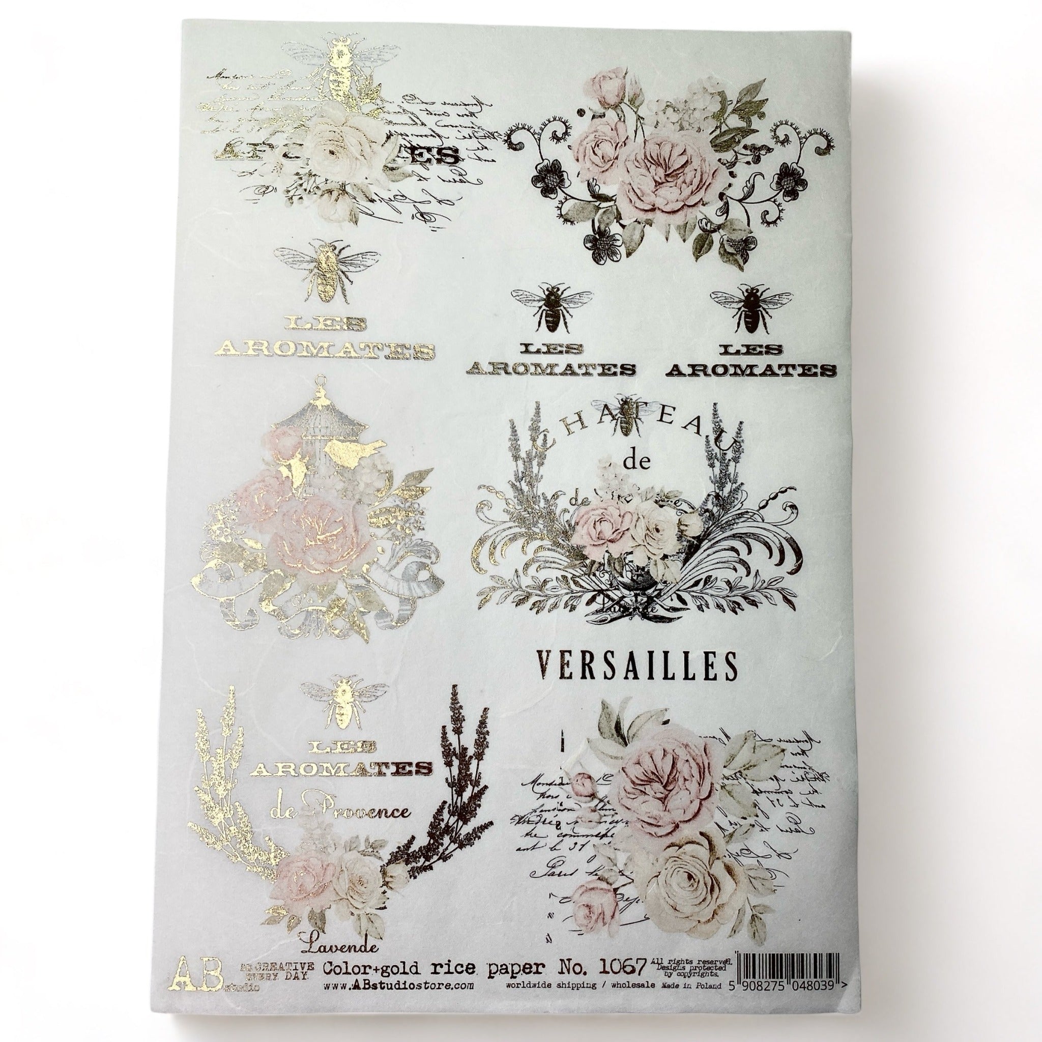 An A4 rice decoupage paper featuring floral designs, birdcages, and French writing highlighted with foil gilding is against a white background.