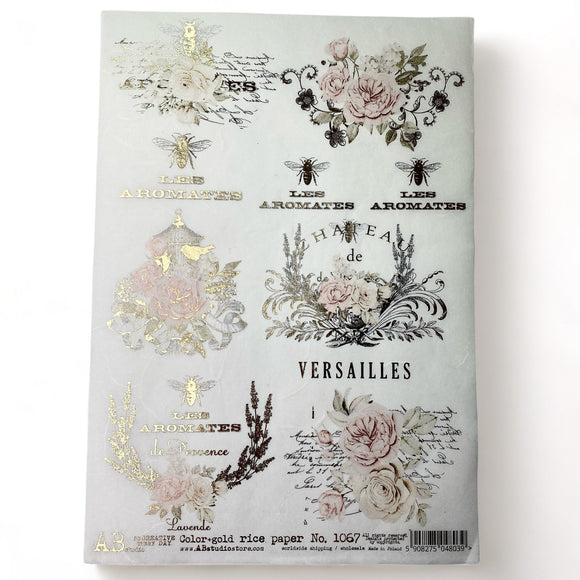 An A4 rice decoupage paper featuring floral designs, birdcages, and French writing highlighted with foil gilding is against a white background.