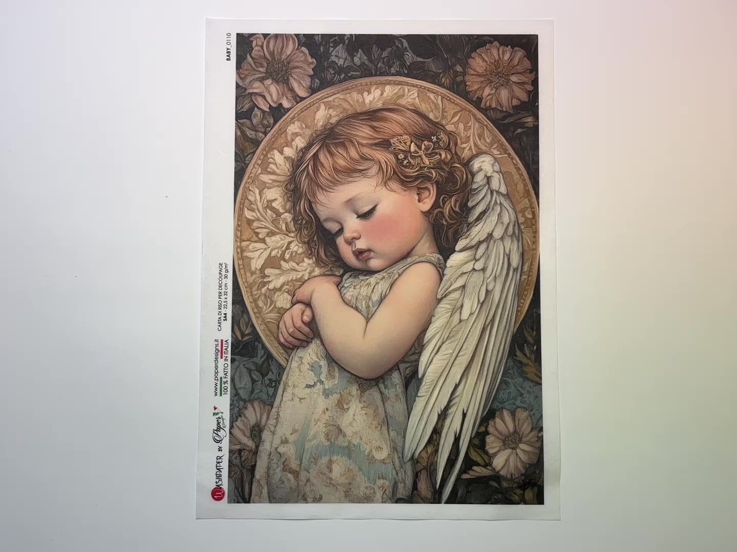 A 13 second video shows a close-up and backside of Paper Designs Italy's Sleeping Angel Baby A4 rice paper against a white background.