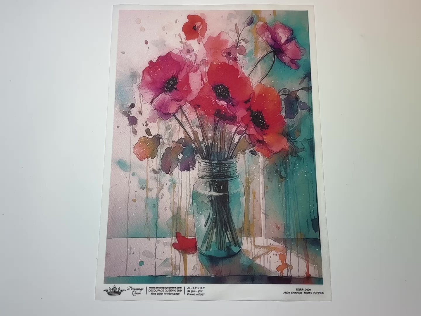 A 13 second video shows a close-up and backside of Decoupage Queen's Andy Skinner Mum's Poppies rice paper against a white background.