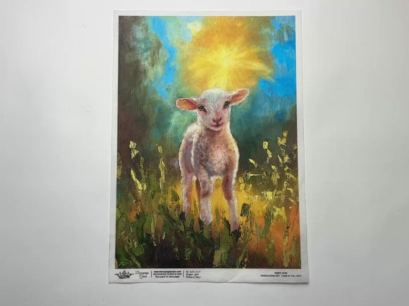 A 14 second video shows a close-up and backside of Decoupage Queen's Lamb in the Light A4 rice paper against a white background.