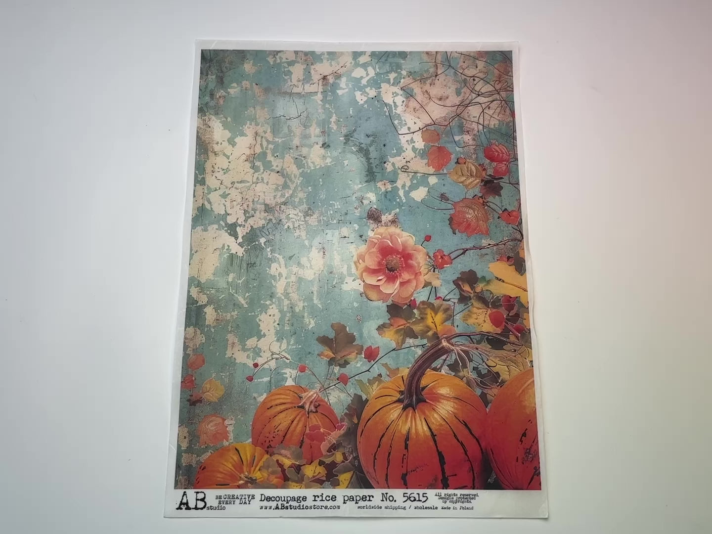 A 14 second video showing a close-up and backside of AB Studio's Fall Pumpkins Aqua Grunge A4 rice decoupage paper is against a white background.