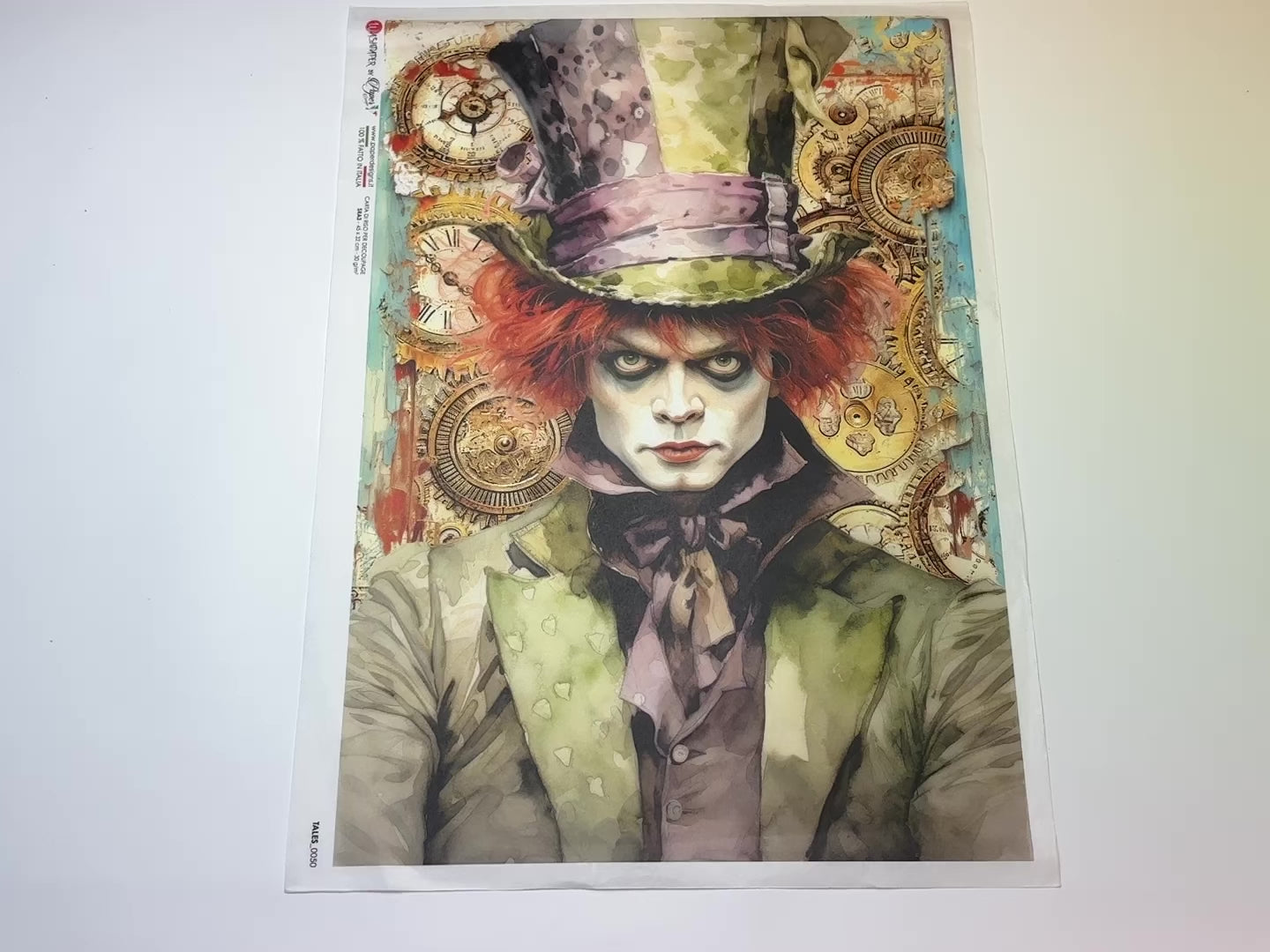 A 14 second video of a close-up and backside of Decoupage Queen's Green Mad Hatter Tales A3 rice paper is against a white background.
