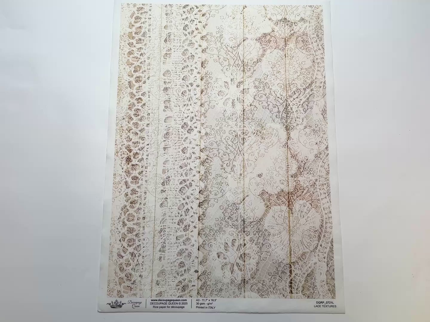 A 14 second video shows a close-up and backside of Decoupage Queen's Lace Textures A3 rice paper against a white background.