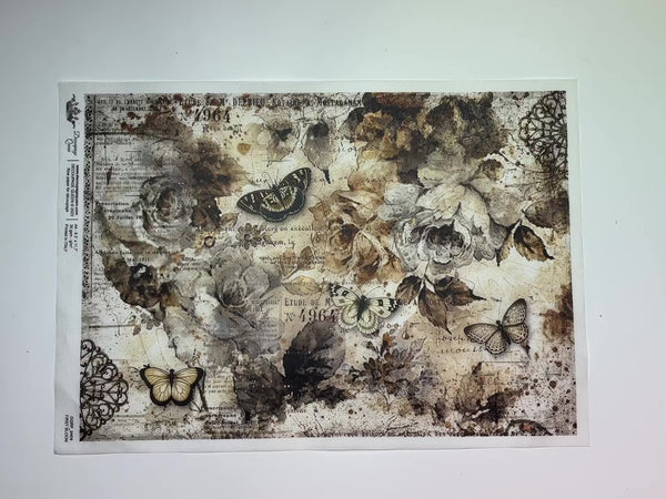 A 12 second video shows a close-up and backside of Decoupage Queen's First Bloom rice paper against a white background.