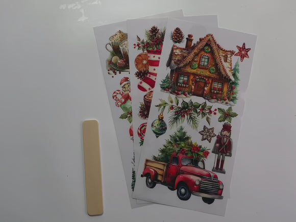 A 14 second video shows a close-up of 3 sheets of ReDesign with Prima's Winter Wonderland Wonders small rub-on transfer.