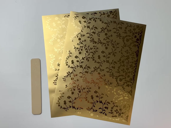 A 14 second video shows a close-up and backside of 2 sheets of ReDesign with Prima's Kacha Vineyard Elegance gold foil small rub-on transfers against a white background.