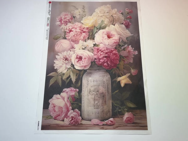 A 13 second video of a close-up and backside of Decoupage Queen's Pink flowers in a mason jar A3 rice paper is against a white background.
