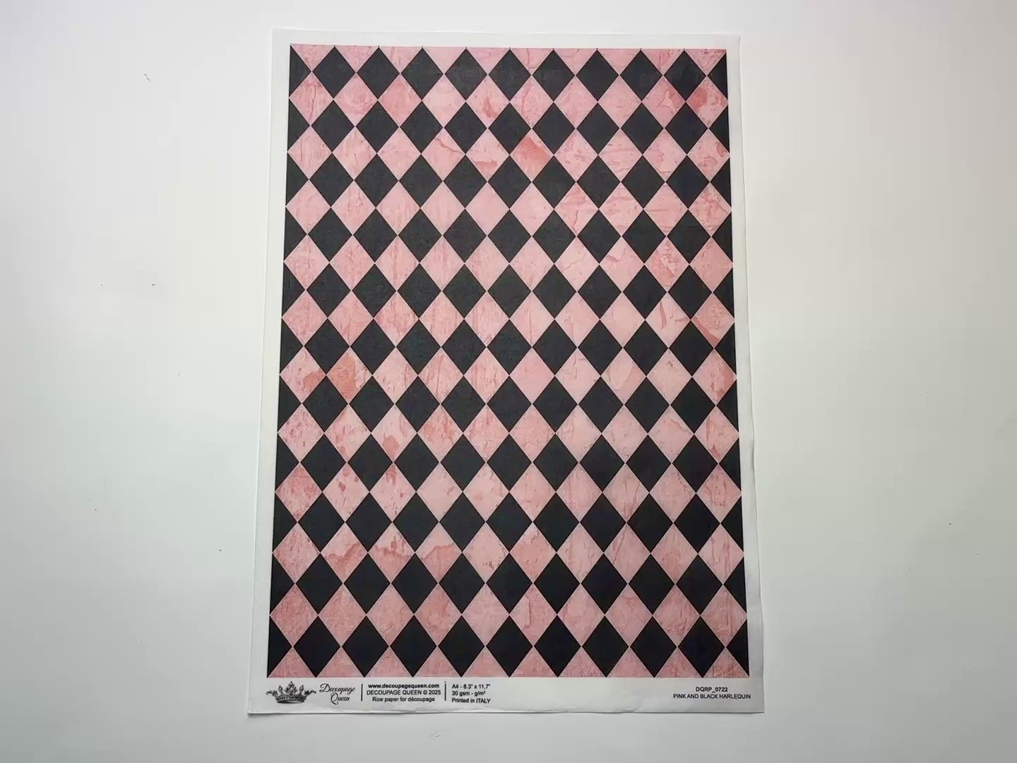 A 14 second video shows a close-up and backside of Decoupage Queen's Pink and Black Harlequin A4 rice paper against a white background.