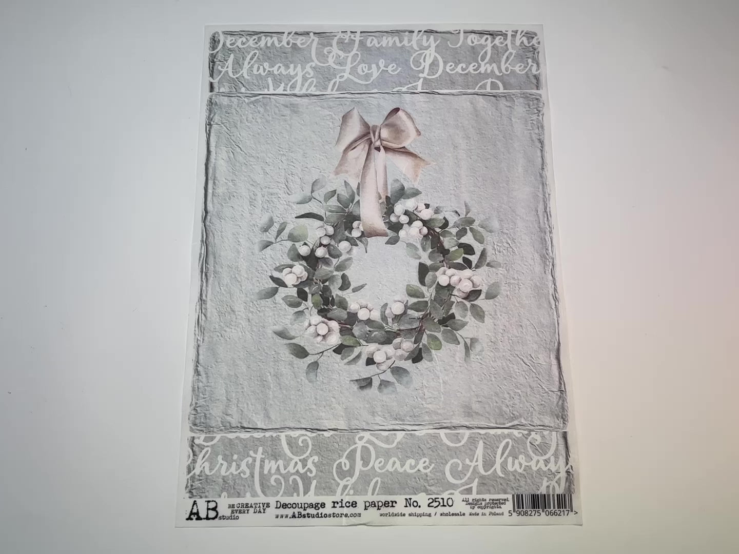 A 12 second video showing a close-up and backside of AB Studio's Farmhouse Christmas Wreath A4 rice decoupage paper is against a white background.