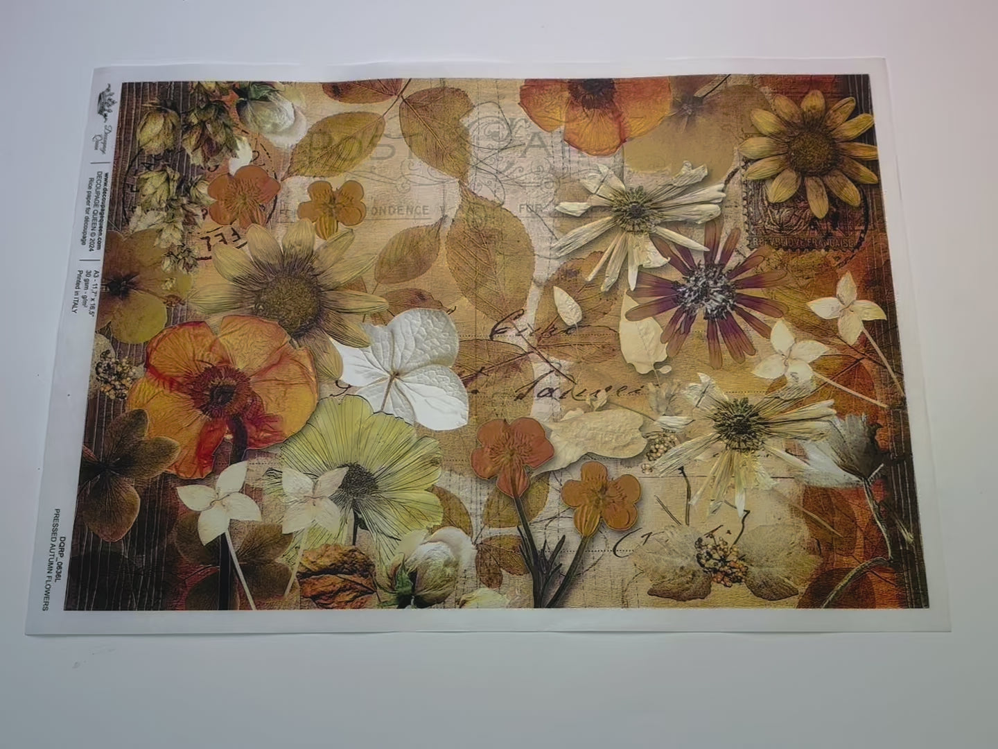 A 14 second video shows a close-up and backside of Decoupage Queen's Pressed Autumn Flowers A3 rice paper.