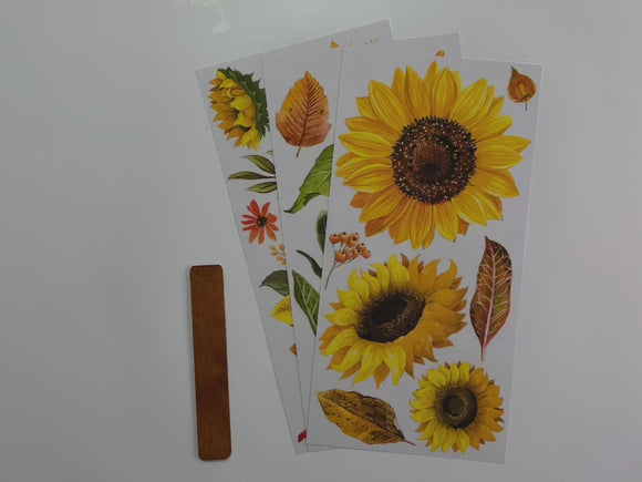 A 14 second video shows a close-up of 3 sheets of ReDesign with Prima's Sunflower Afternoon small rub-on transfer.