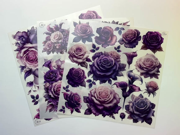 A 14 second video shows a close-up of 3 sheets of Zuri Design's Amethyst Garden small rub-on transfers against a white background.