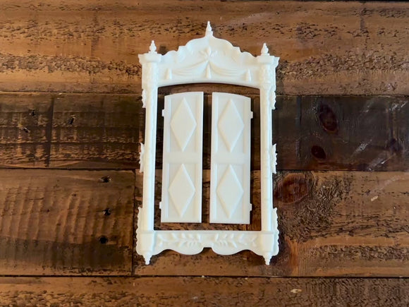 A 13 second video shows a close-up of white resin castings created from LaBlanche's Vintage Window silicone mold against a wood background. A hand is shown picking up one of the casting pieces.