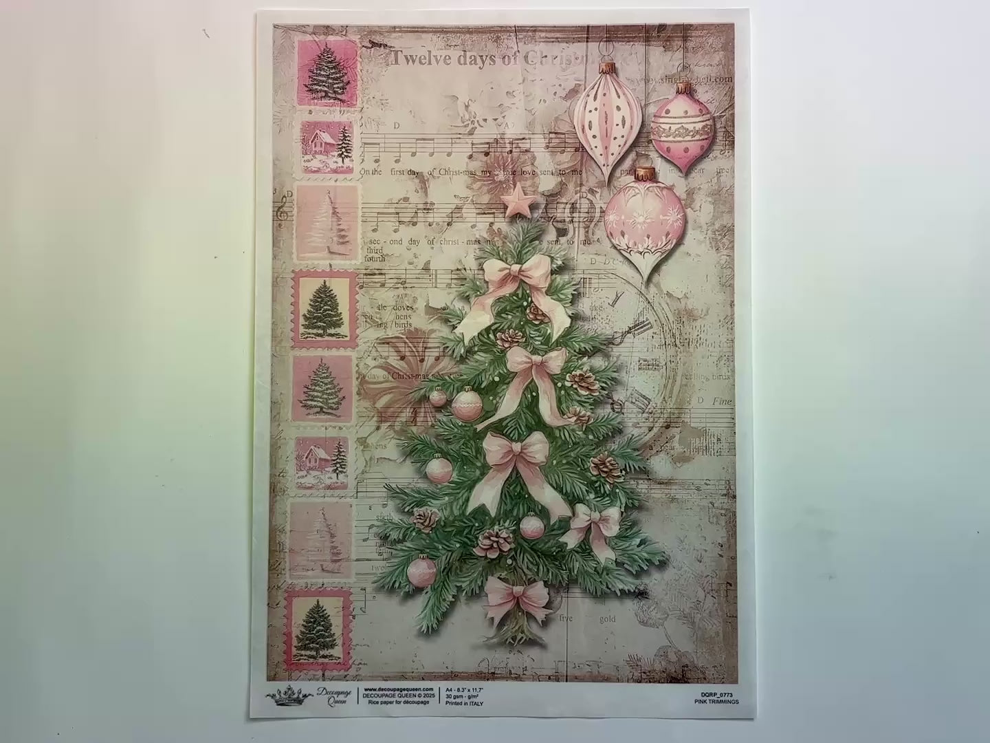 A 13 second video shows a close-up and backside of Decoupage Queen's Pink Trimmings A4 rice paper against a white background.