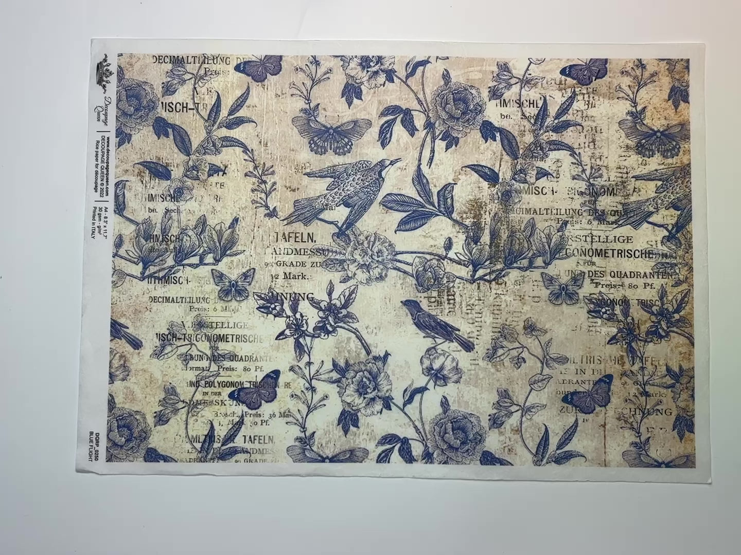 A 13 second video shows a close-up and backside of Decoupage Queen's Blue Flight rice paper against a white background.