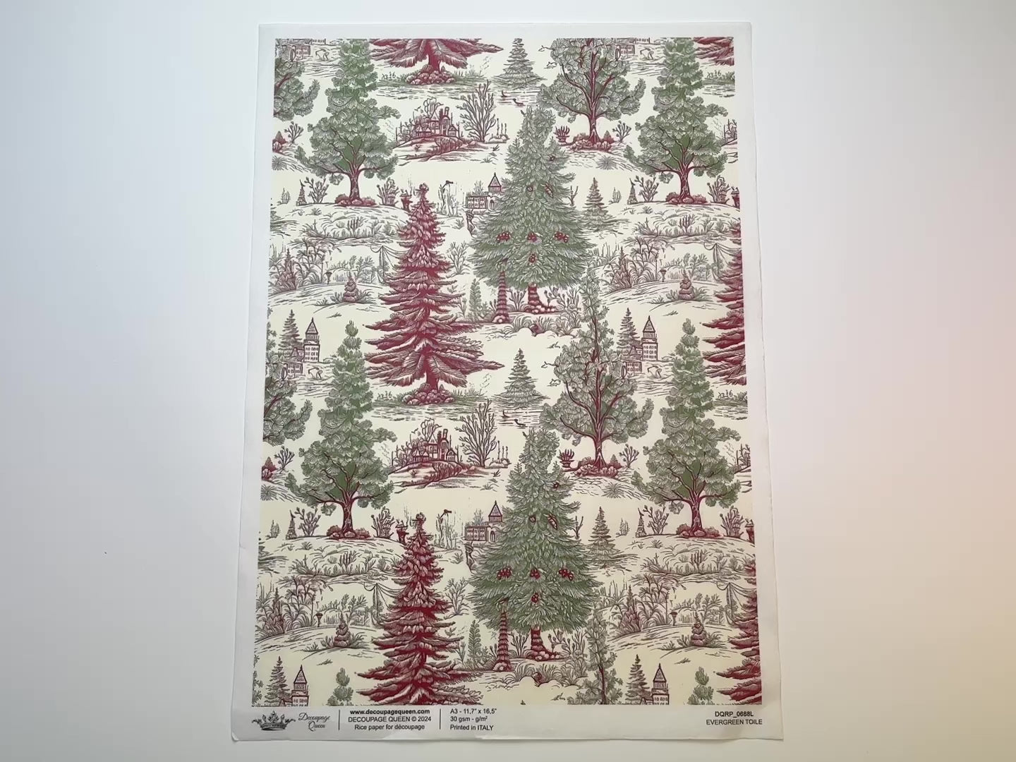 A 15 second video shows a close-up and backside of Decoupage Queen's Evergreen Toile A3 rice paper against a white background.